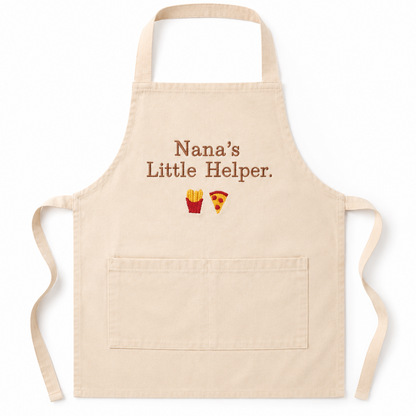 Beige apron with 'Nana's Little Helper' text and food icons on a white background