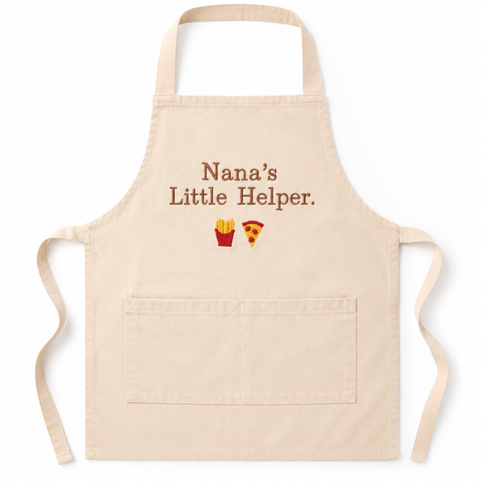 Beige apron with 'Nana's Little Helper' text and food icons on a white background