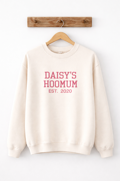 Beige sweatshirt with pink text 'DAISY'S HOOMUM EST. 2020' on a white background